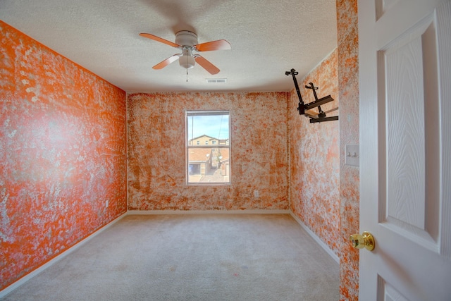 5750 Quay St, Rio Rancho, NM 87144 - empty room featuring visible vents, a textured ceiling, and wallpapered walls