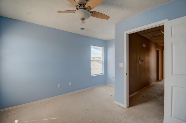 5750 Quay St, Rio Rancho, NM 87144 - unfurnished room featuring light carpet, a textured ceiling, and a ceiling fan