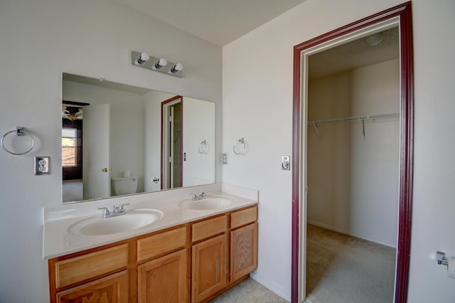 5750 Quay St, Rio Rancho, NM 87144 - full bath featuring a walk in closet, double vanity, toilet, and a sink