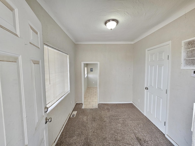 unfurnished bedroom featuring visible vents and carpet flooring