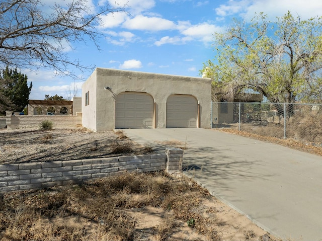 3213 May Cir SE, Rio Rancho, NM 87124 - exterior space featuring fence, driveway, and stucco siding