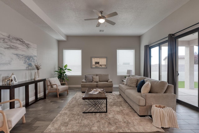1954 Castle Peak Loop NE, Rio Rancho, NM 87144 - living room featuring a textured ceiling, ceiling fan, and wood finished floors