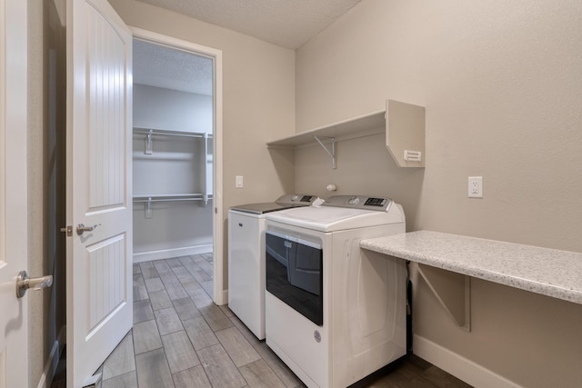 1954 Castle Peak Loop NE, Rio Rancho, NM 87144 - washroom with separate washer and dryer, wood finished floors, and a textured ceiling