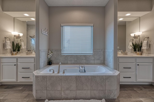1954 Castle Peak Loop NE, Rio Rancho, NM 87144 - bathroom with two vanities, a bath, and a shower