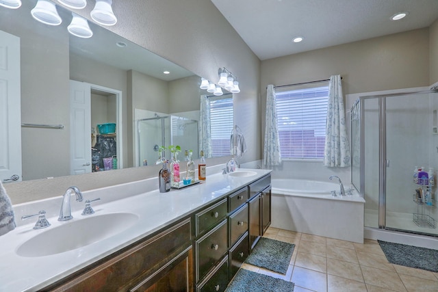 full bath featuring a garden tub, a stall shower, double vanity, and a sink