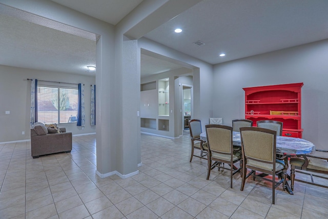 dining area with baseboards, visible vents, light tile patterned floors, and recessed lighting