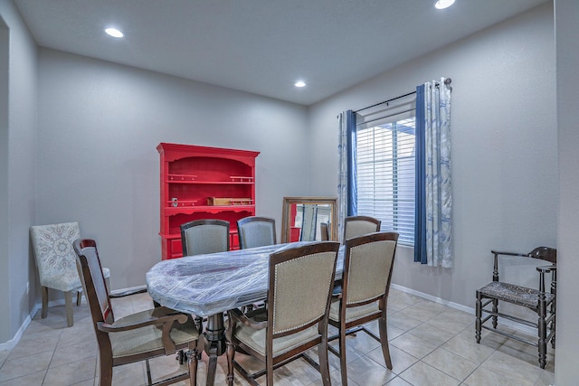 dining room featuring baseboards, recessed lighting, and light tile patterned flooring
