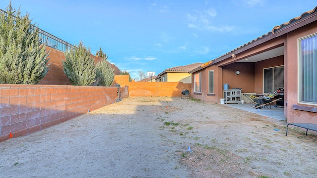 view of yard with a patio and a fenced backyard