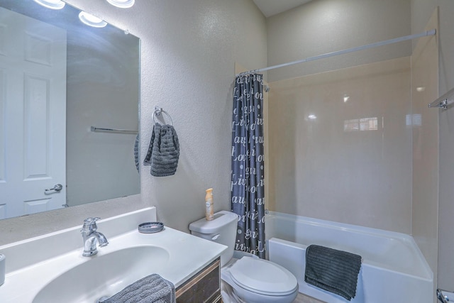 full bathroom with toilet, shower / bath combo, a textured wall, and vanity