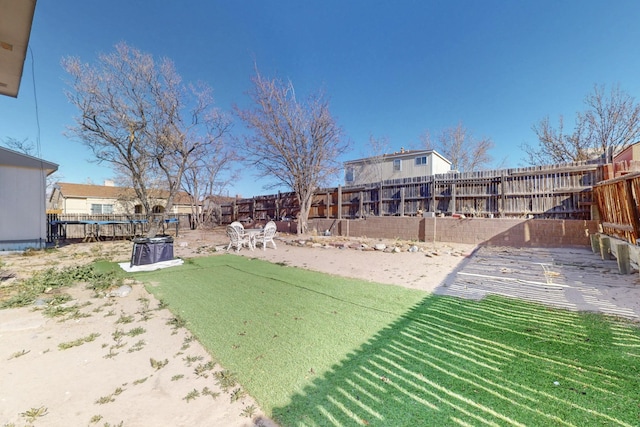 view of yard with a fenced backyard and a patio area