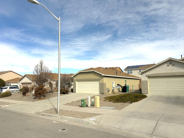 131 Las Ramblas Ave NW, Rio Rancho, NM 87144 - single story home featuring stucco siding and a garage