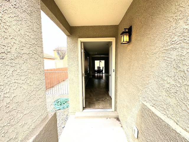 131 Las Ramblas Ave NW, Rio Rancho, NM 87144 - doorway to property with stucco siding