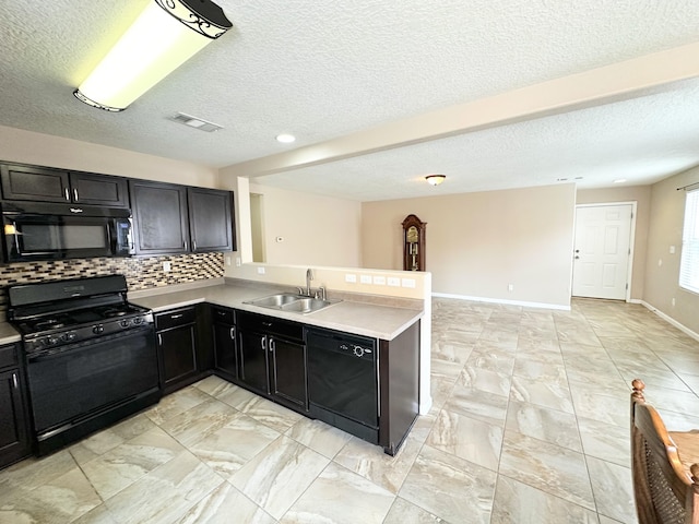 131 Las Ramblas Ave NW, Rio Rancho, NM 87144 - kitchen featuring black appliances, a sink, light countertops, tasteful backsplash, and a textured ceiling