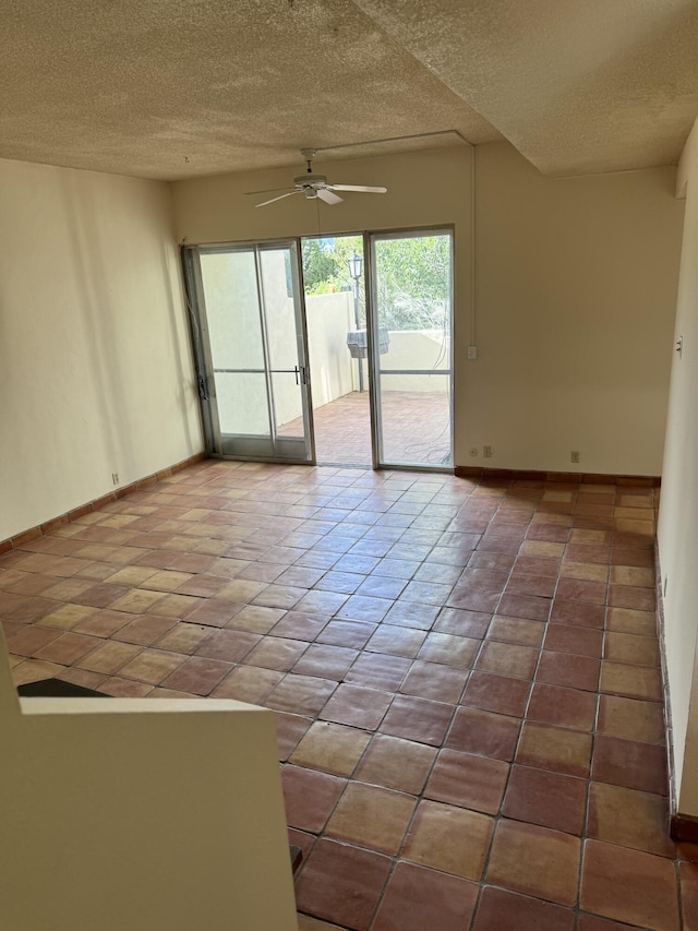 6488 Tahawash St, Cochiti Lake, NM 87083 - tiled empty room featuring baseboards, ceiling fan, and a textured ceiling
