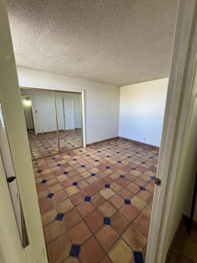 6488 Tahawash St, Cochiti Lake, NM 87083 - unfurnished room featuring baseboards and a textured ceiling