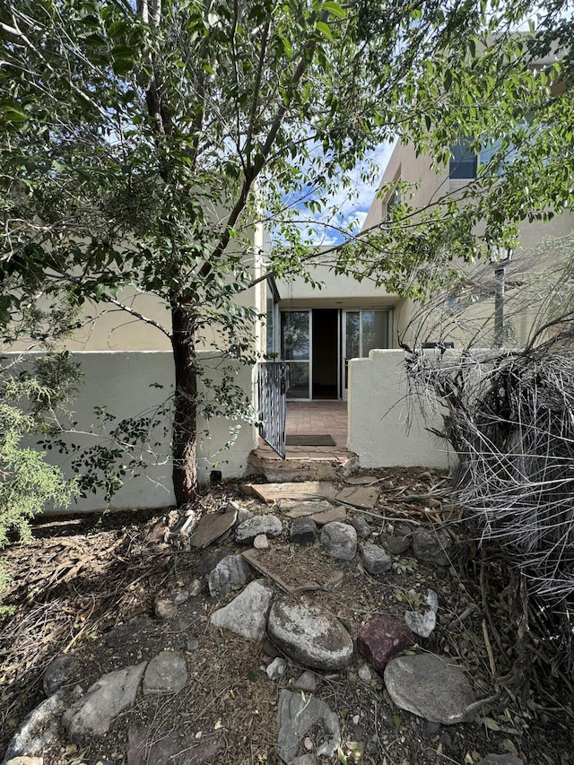 6488 Tahawash St, Cochiti Lake, NM 87083 - back of house featuring stucco siding