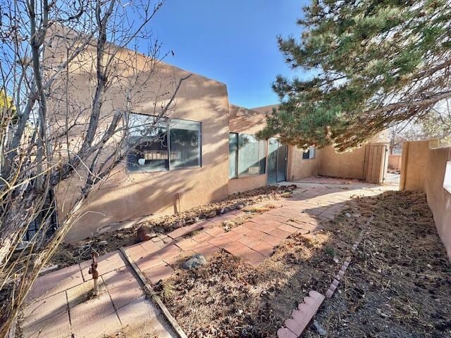 701 Houston Ave, Grants, NM 87020 - rear view of house featuring fence