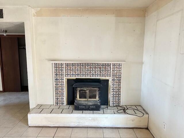 701 Houston Ave, Grants, NM 87020 - room details featuring visible vents and a wood stove