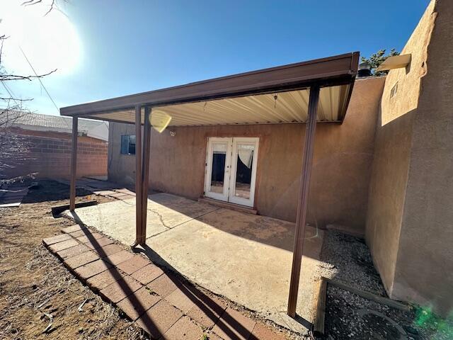 701 Houston Ave, Grants, NM 87020 - view of patio / terrace featuring fence and french doors