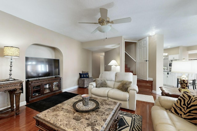 6404 Oak Hill NE, Albuquerque, NM 87111 - living area featuring baseboards, stairway, ceiling fan, and dark wood-type flooring
