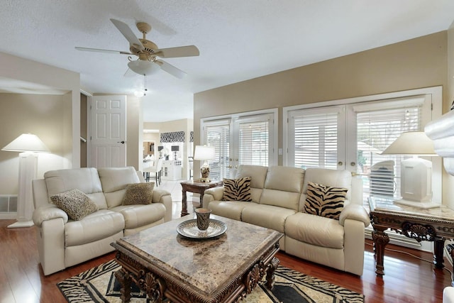 6404 Oak Hill NE, Albuquerque, NM 87111 - living area featuring visible vents, wood finished floors, french doors, and a ceiling fan