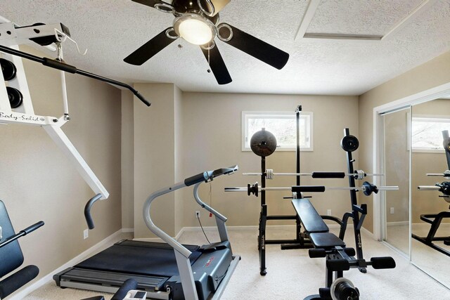 6404 Oak Hill NE, Albuquerque, NM 87111 - exercise area with a textured ceiling, ceiling fan, and plenty of natural light