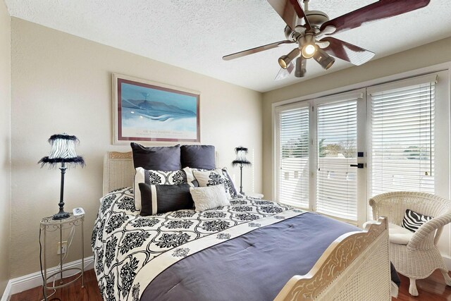 6404 Oak Hill NE, Albuquerque, NM 87111 - bedroom with baseboards, a textured ceiling, access to exterior, ceiling fan, and wood finished floors