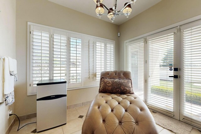 6404 Oak Hill NE, Albuquerque, NM 87111 - sitting room with tile patterned floors, baseboards, and a chandelier