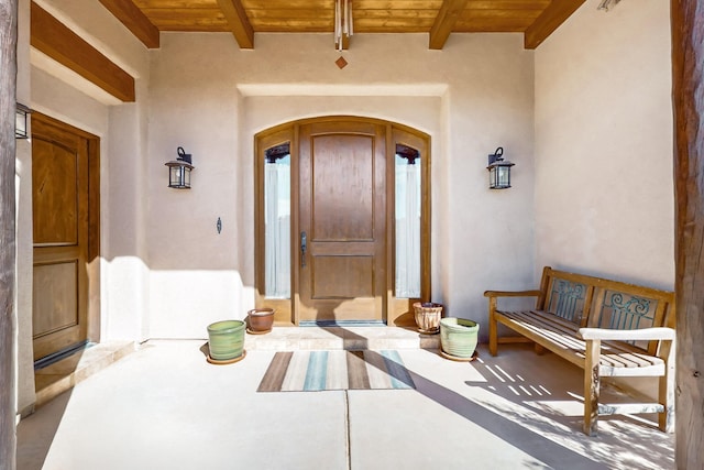property entrance with stucco siding