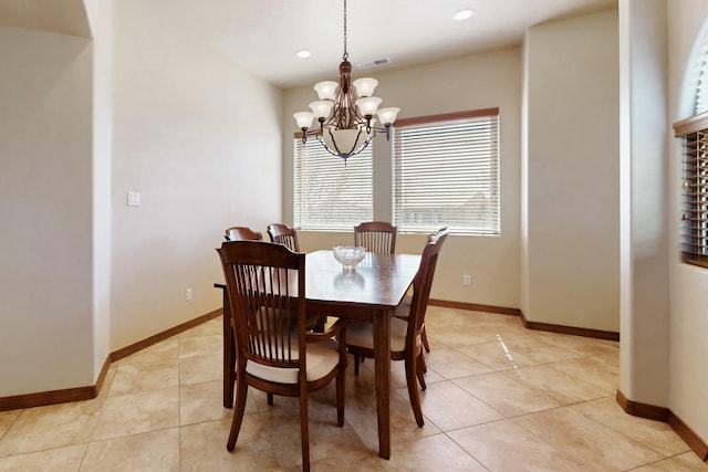 dining area with light tile patterned flooring, baseboards, a chandelier, and recessed lighting