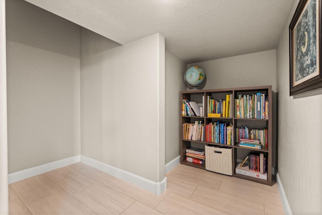 2422 Lynn Rd SE, Rio Rancho, NM 87124 - interior space featuring a textured ceiling and baseboards