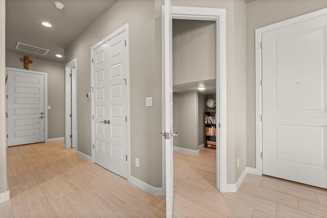 2422 Lynn Rd SE, Rio Rancho, NM 87124 - hall with baseboards, light wood finished floors, recessed lighting, and visible vents