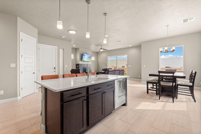 2422 Lynn Rd SE, Rio Rancho, NM 87124 - kitchen featuring a sink, baseboards, dishwasher, and visible vents
