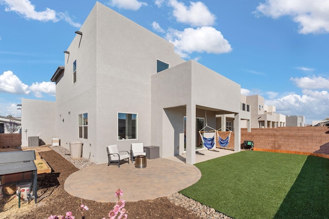 2422 Lynn Rd SE, Rio Rancho, NM 87124 - rear view of house featuring a patio, a fenced backyard, a lawn, and stucco siding
