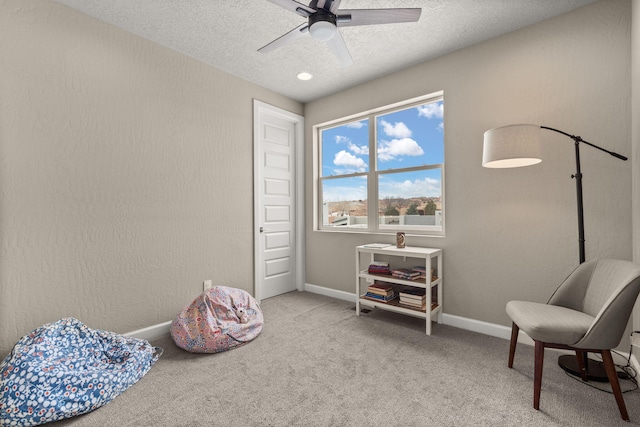 2422 Lynn Rd SE, Rio Rancho, NM 87124 - sitting room with a ceiling fan, baseboards, carpet, and a textured ceiling