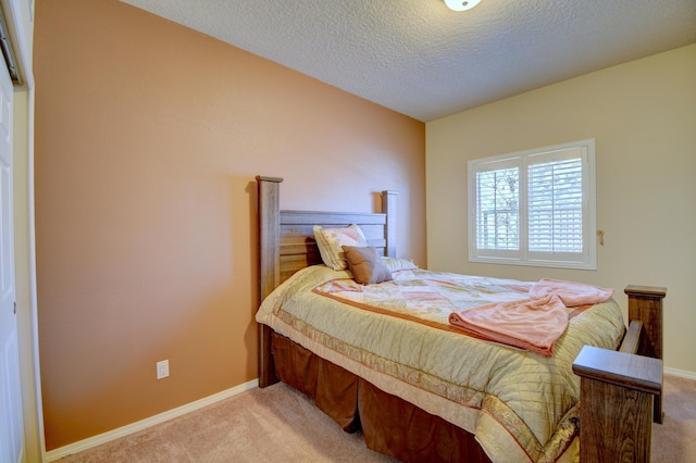 10916 Calandrias St NW, Albuquerque, NM 87114 - bedroom with light colored carpet, baseboards, and a textured ceiling