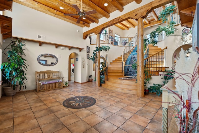 lobby featuring stairs, visible vents, and washer / clothes dryer