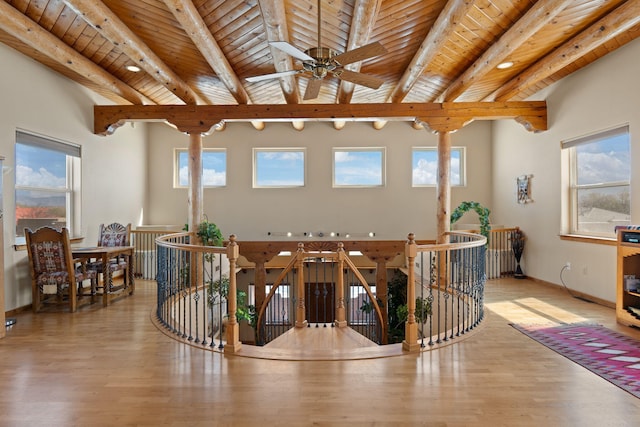 sunroom with beam ceiling and a wealth of natural light