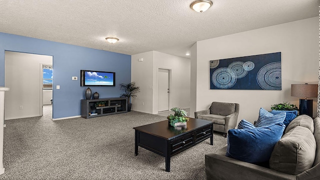 carpeted living room with a textured ceiling and baseboards
