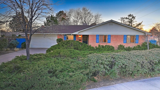 3809 Julie St NE, Albuquerque, NM 87110 - single story home featuring brick siding, a garage, and driveway