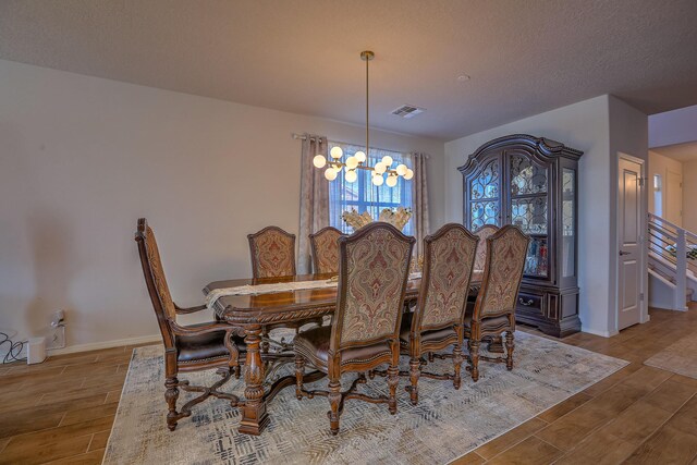 8717 Sevano Cir NE, Albuquerque, NM 87113 - foyer entrance with light wood-style floors, stairs, a chandelier, and baseboards