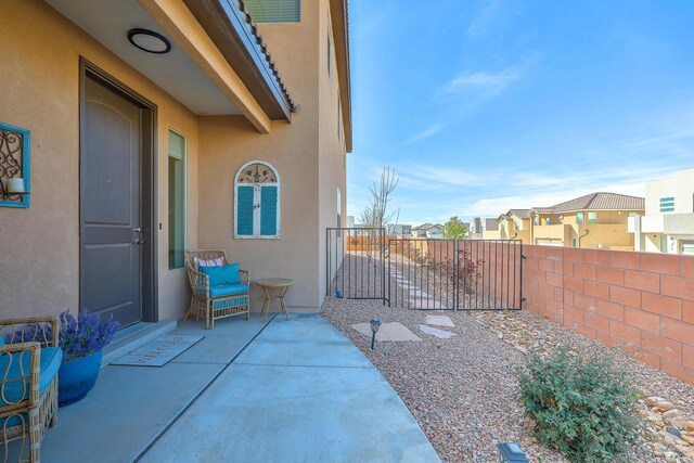 8717 Sevano Cir NE, Albuquerque, NM 87113 - entrance to property with stucco siding