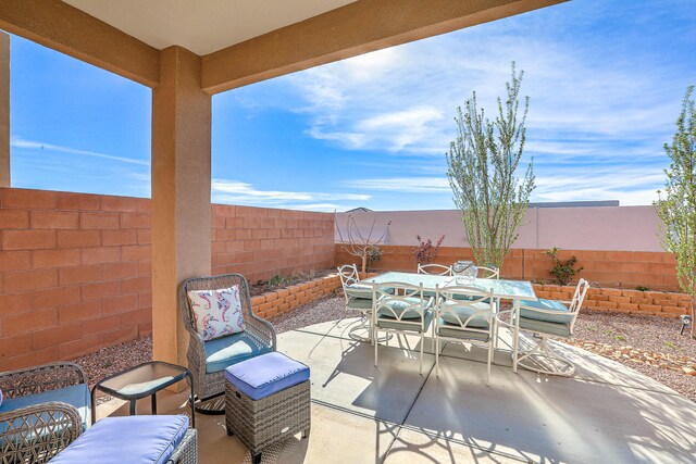 8717 Sevano Cir NE, Albuquerque, NM 87113 - view of front of house featuring a residential view, a fenced backyard, and stucco siding