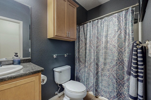 601 Menaul Blvd NE Unit 306, Albuquerque, NM 87107 - bathroom with a shower with shower curtain, toilet, vanity, a textured ceiling, and a textured wall