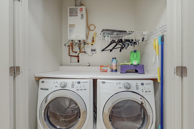 601 Menaul Blvd NE Unit 306, Albuquerque, NM 87107 - clothes washing area featuring tankless water heater and washer and dryer