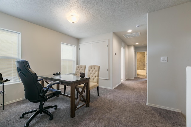 9620 Sage Ranch Ct SW, Albuquerque, NM 87121 - office area with dark colored carpet and a textured ceiling