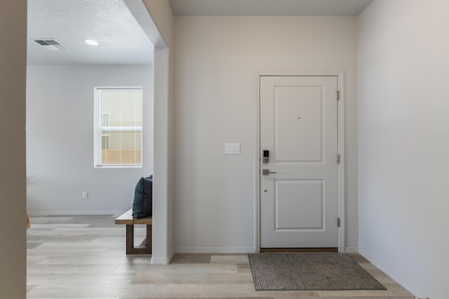 9620 Sage Ranch Ct SW, Albuquerque, NM 87121 - foyer featuring light wood finished floors and baseboards