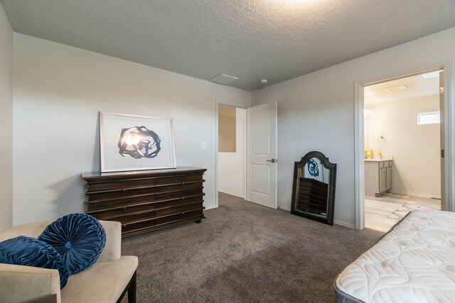 9620 Sage Ranch Ct SW, Albuquerque, NM 87121 - carpeted bedroom featuring a textured ceiling and ensuite bathroom
