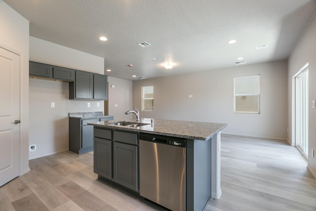 9600 Sage Ranch Ct SW, Albuquerque, NM 87121 - kitchen featuring dishwasher, light wood-style flooring, a center island with sink, light stone countertops, and recessed lighting
