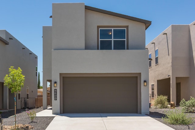 9600 Sage Ranch Ct SW, Albuquerque, NM 87121 - view of front of house with stucco siding, concrete driveway, and a garage